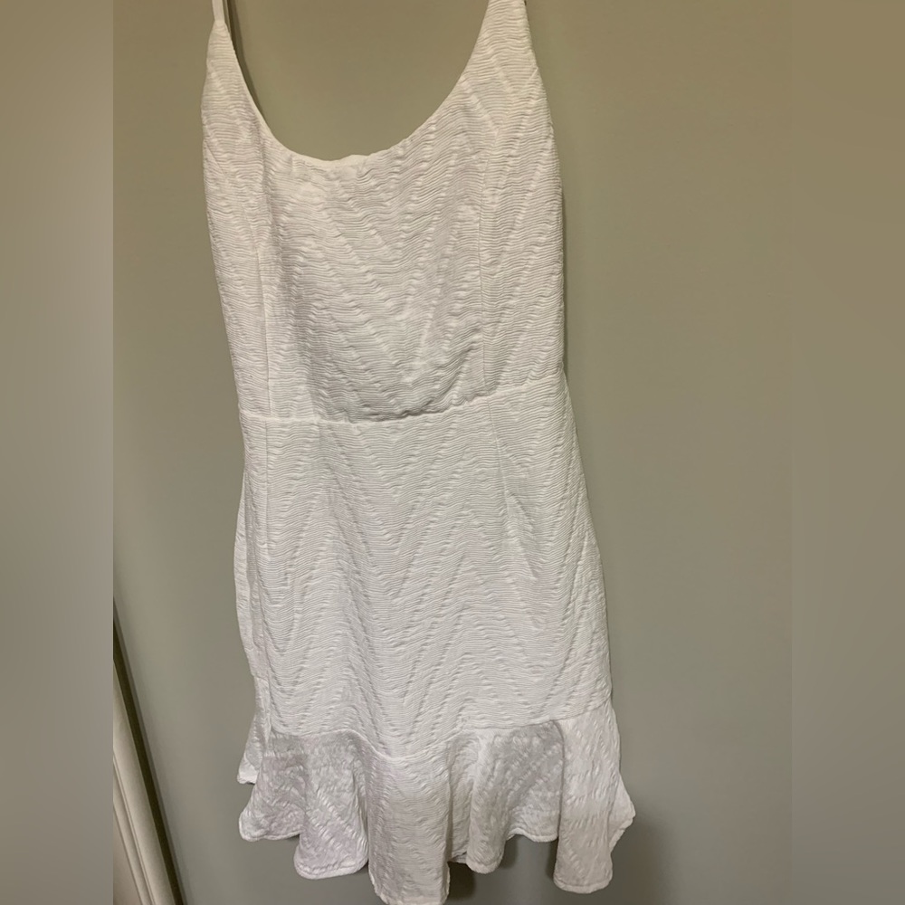 White, backless summer find by Saints + Secrets.